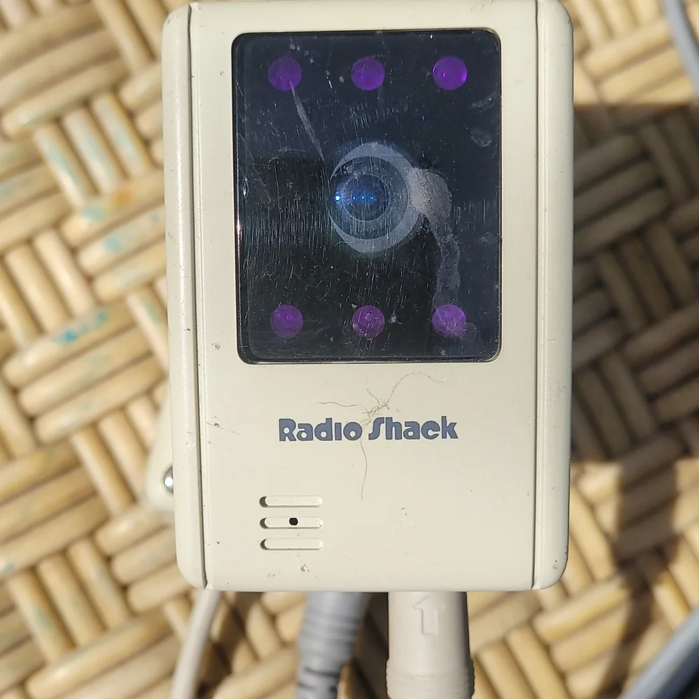 Old radio shack outdoor camera with video and power cord.